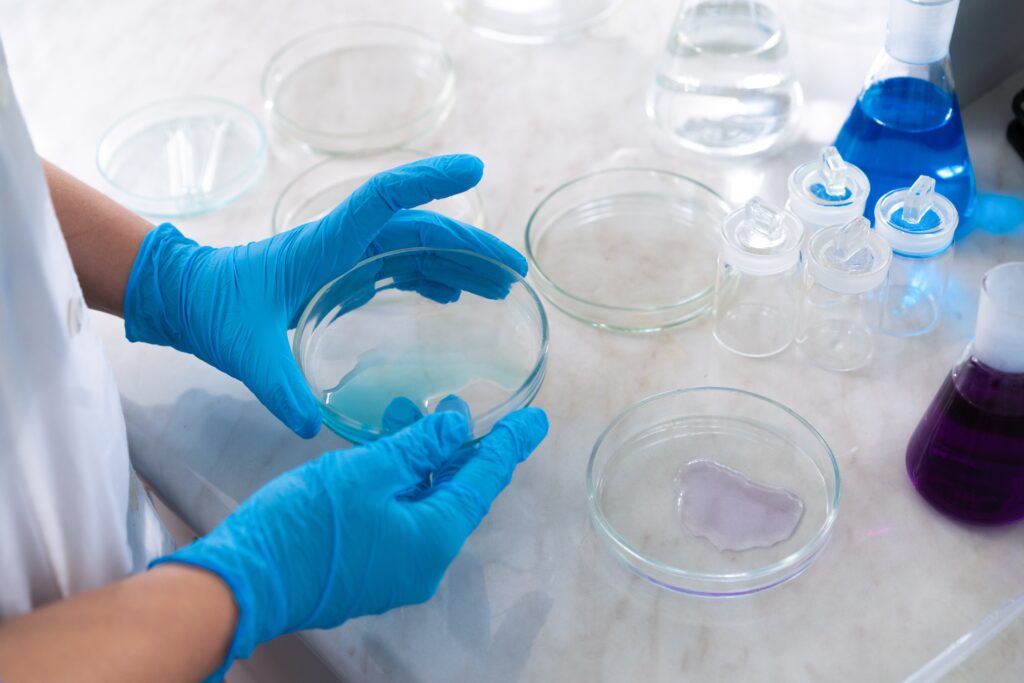 A scientist does microbial testing in a laboratory, exhibiting the process of evaluating samples for microorganisms to assure product safety and quality.